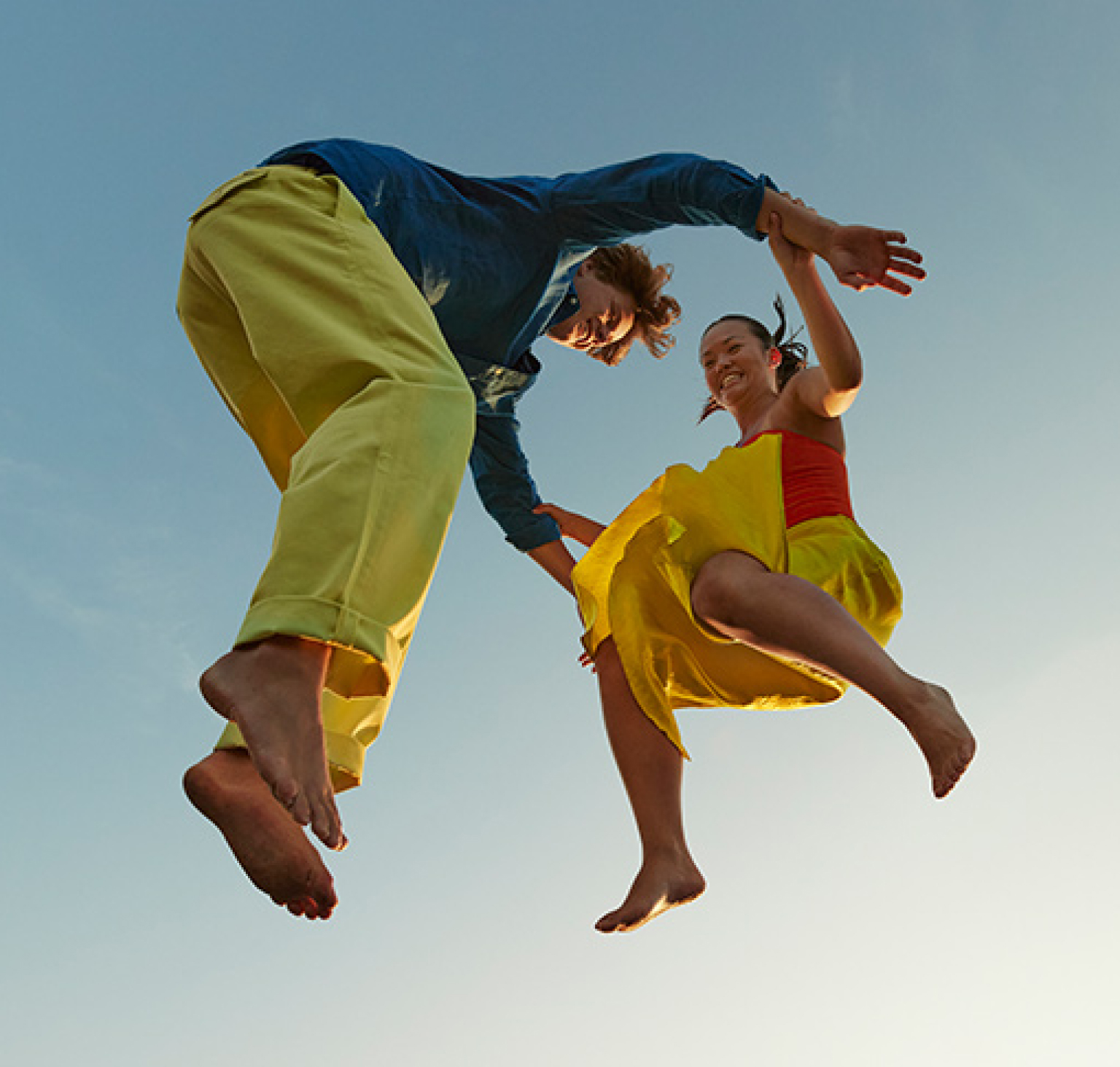 Two people jumping