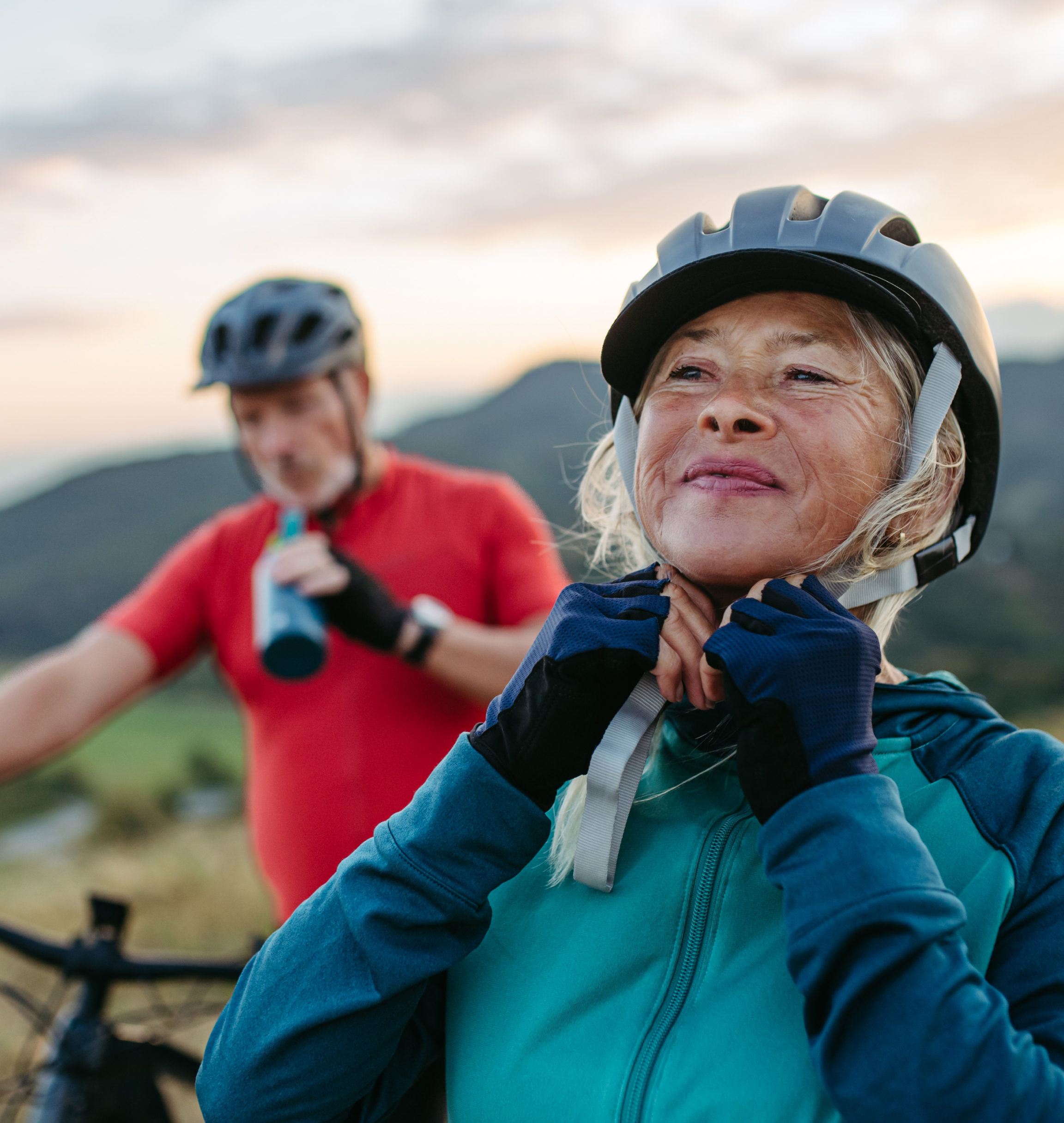 Older woman cycling outdoors
